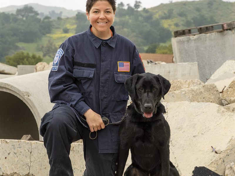 Search Dog Barney with handler Lauren Canning on rubble