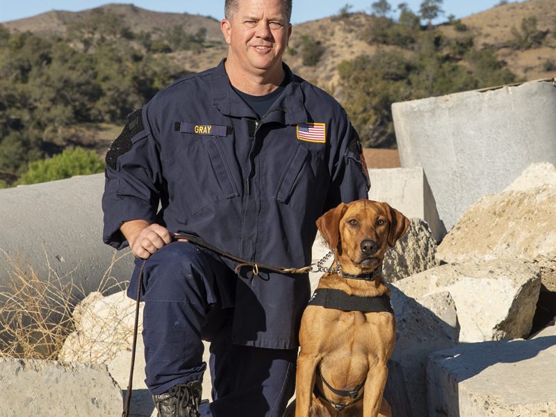 Search Dog Dee with handler Captain Eric Gray on rubble